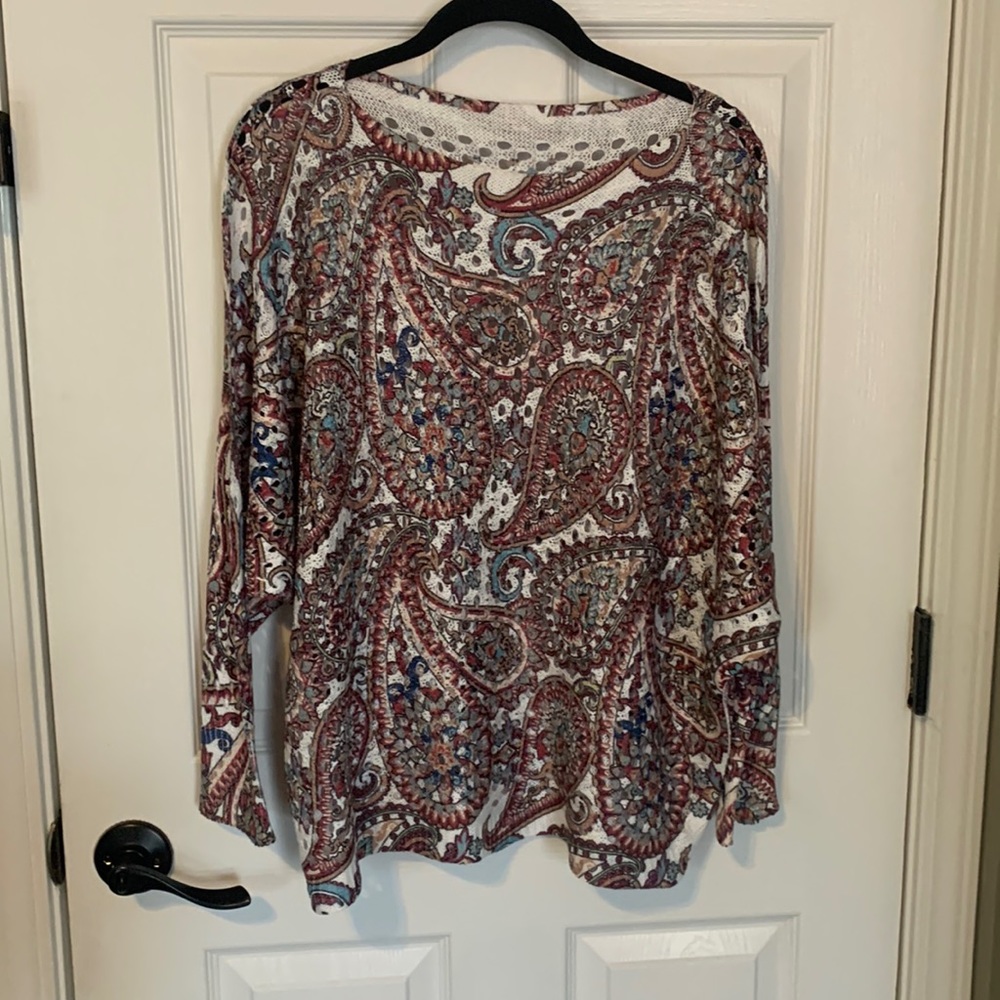 Light weight beautiful batwing sweater I purchased in Italy. Never been worn.